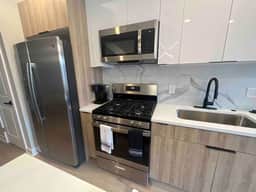 4 bed bi-level with roof deck. In the city.